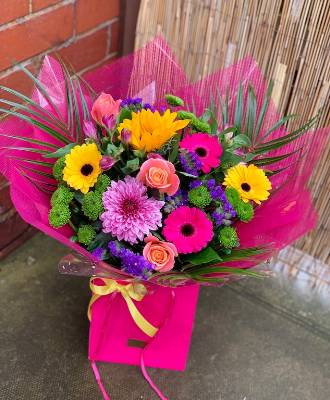 Tropical coloured flowers with pink wrapping. 