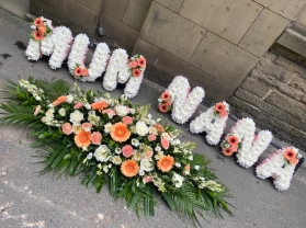Peach dream casket spray