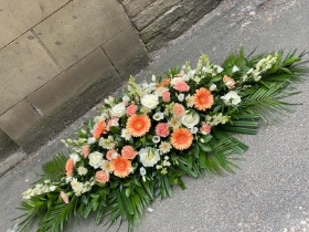 Peach dream casket spray
