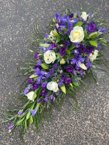 Purple teardrop casket spray