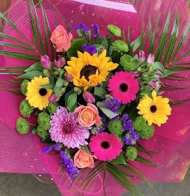 Tropical coloured flowers with pink wrapping. 