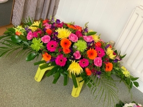 Vibrant double ended casket spray