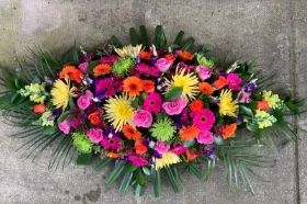 Vibrant double ended casket spray