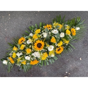 Yellow casket spray